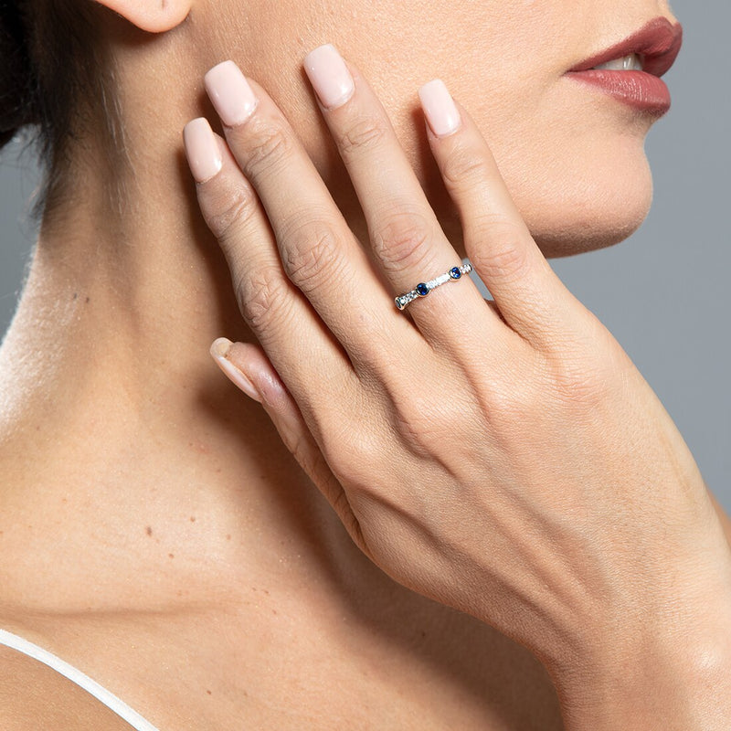 Created Blue Sapphire Bezel Stackable Ring In Sterling Silver Sizes 5 To 9 Sr12034 on a model