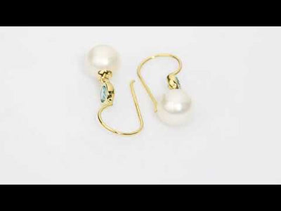 Video of 8mm Freshwater Cultured White Pearl and Swiss Blue Topaz Fish Hook Earrings in 14K Yellow Gold.  E19374