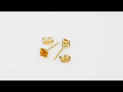 Video of 4mm Round Citrine Solitaire Stud Earrings in 14K Yellow Gold.  Includes a Peora gift box. Free shipping, 45-day returns, authenticity guaranteed. E19348