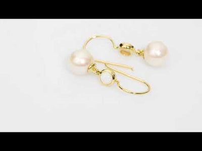 Video of 8mm Freshwater Cultured White Pearl and Created White Fire Opal Fish Hook Earrings in 14K Yellow Gold. Includes a Peora gift box. Free shipping, 45-day returns, authenticity guaranteed. E19370