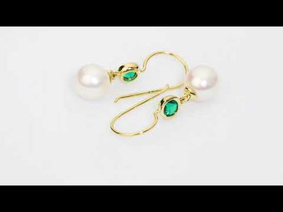 Video of  8mm Freshwater Cultured White Pearl and Created Emerald Fish Hook Earrings in 14K Yellow Gold. Includes a Peora gift box. Free shipping, 45-day returns, authenticity guaranteed. E19360