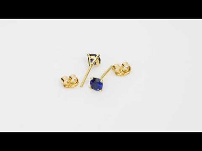 Video of 4mm Round Created Blue Sapphire Solitaire Stud Earrings in 14K Yellow Gold.  Includes a Peora gift box. Free shipping, 45-day returns, authenticity guaranteed. E19344