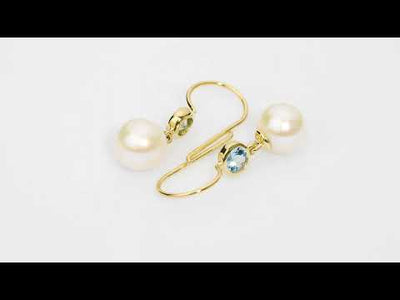 Video of 8mm Freshwater Cultured White Pearl and Aquamarine Fish Hook Earrings in 14K Yellow Gold.  Includes a Peora gift box. Free shipping, 45-day returns, authenticity guaranteed. E19356