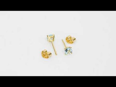 Video of 4mm Round Aquamarine Solitaire Stud Earrings in 14K Yellow Gold.  Includes a Peora gift box. Free shipping, 45-day returns, authenticity guaranteed. E19332