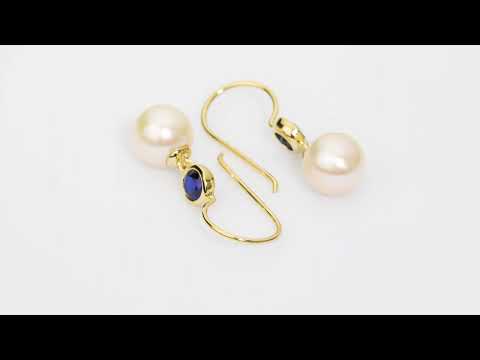 Video of 8mm Freshwater Cultured White Pearl and Created Blue Sapphire Fish Hook Earrings in 14K Yellow Gold.  Includes a Peora gift box. Free shipping, 45-day returns, authenticity guaranteed. E19368