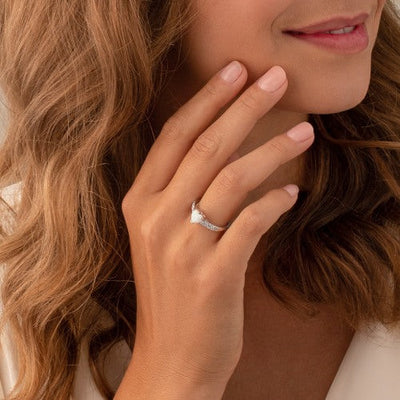 Created White Opal Heart Gemstone ring in .925 Sterling Silver on a model's finger by Peora